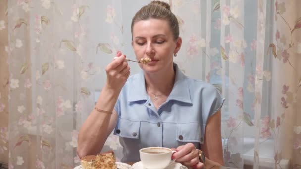 Young Woman Eats Table She Drinks Coffee Delicious Cake — Wideo stockowe