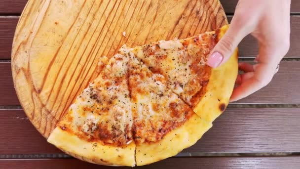 Woman Hand Breaks Slice Hot Fragrant Pizza Lying Wooden Tray — Stock Video