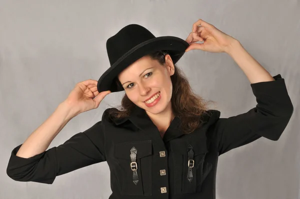 Portrait of a girl in a black hat on a white background Stock Photo