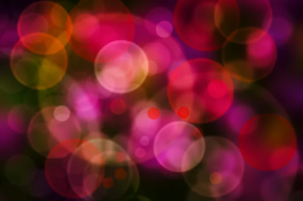 Cercles lumineux colorés abstraits sur un fond coloré — Photo