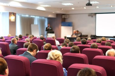 People sitting rear at the business conference and speaker