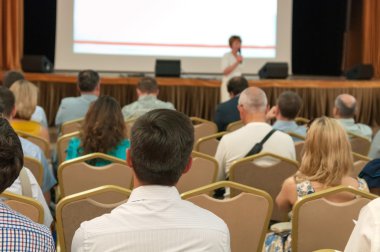 People sitting rear at the business conference and speaker