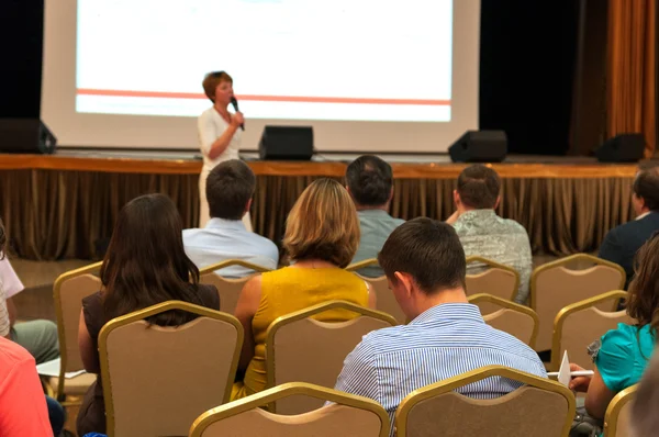 People sitting rear at the business conference and speaker — Stock Photo, Image