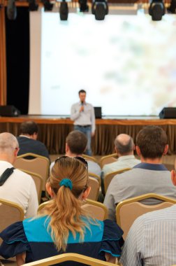 People sitting rear at the business conference and speaker