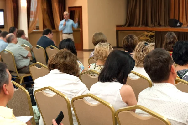 People sitting rear at the business conference and speaker — Stock Photo, Image