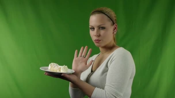 Girl refuses to eat cream horns No.02 — Stock Video