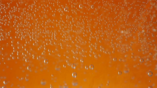 Macro bubbles of water on orange background — Stock Video