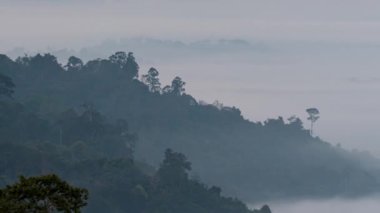 Morning mist at Khao Kho Viewpoint, Chiang Mai Phetchabun. Fog around the mountain. Pan right