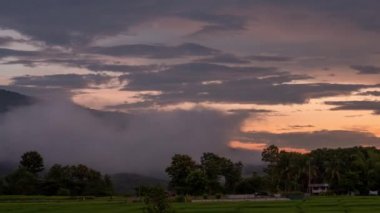 The flow of mist along the foothills In a rural area of Pua District, Nan Province, Thailand