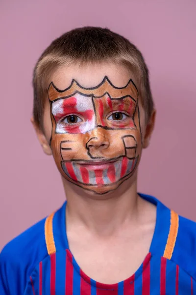 A child fan of the Barcelona football club. Adorable soccer fun