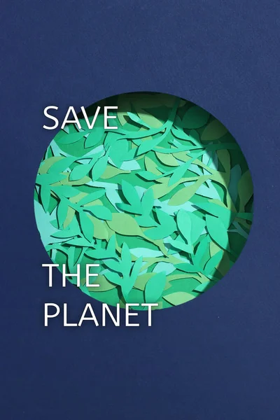 Green leaves on paper planet in center. Concept earth day, save the planet card