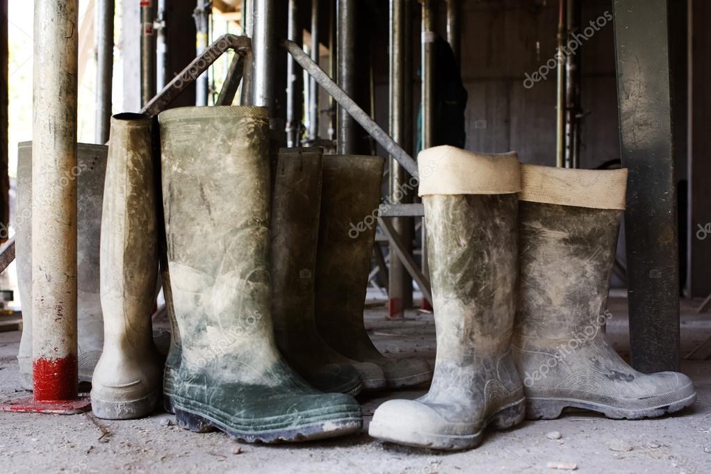 Dirty galoshes at a construction site — Stock Photo © Gaschwald #28593095