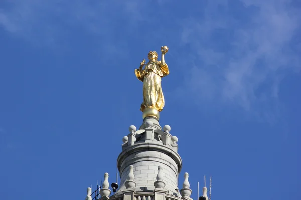Statue of Justice On Top Of The Municipal Building In New York City with Bright Blue Sky Background