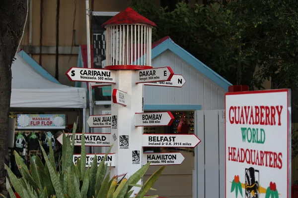 Tourist Guidepost as to World Cities and Distances from Guava Berry Rum Store in Philipsburg St. Maarten — Stock Photo, Image