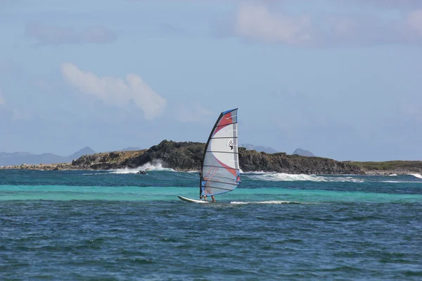 Wind Surfer with colorful board and sail at Orient Beach in St. Martin — Stock Photo, Image