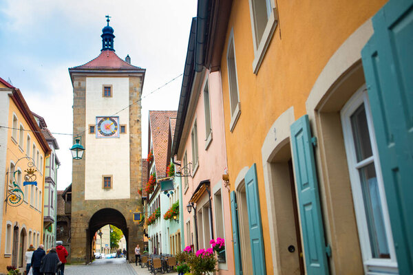 The old clock tower on the streets of the fairy tale town of Rothenburg, Germany