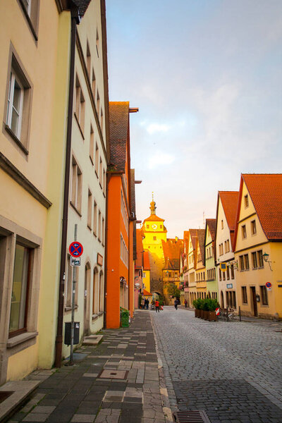 The old clock tower on the streets of the fairy tale town of Rothenburg, Germany