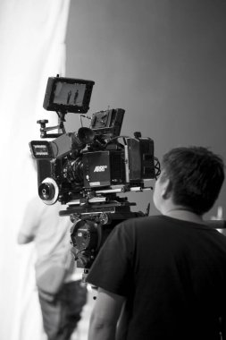 Photographer in studio shooting commercial video