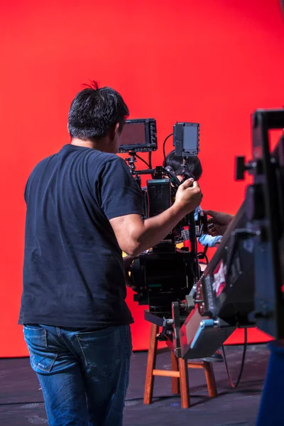 Photographer in studio shooting commercial video