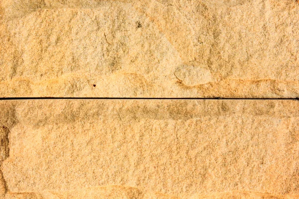 Oppervlakte muur van stenen en zand stucwerk textuur achtergrond — Stockfoto