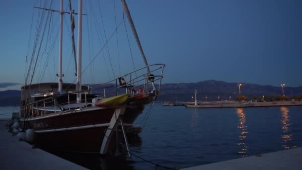 Wooden yacht in the evening in Supetar town in Croatia - 4K, Editorial — Stock Video