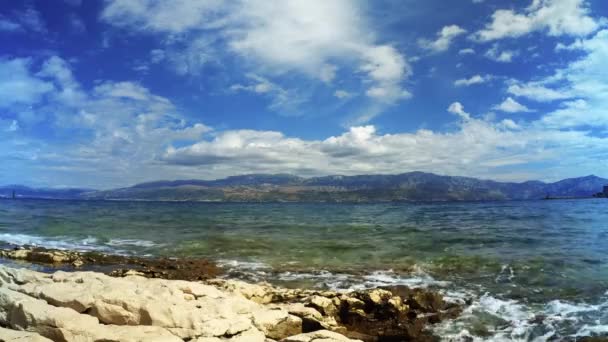 Rocky beach in Supetar town and hills on the horizon, Croatia - 4K, Ultra-wide shot, Binaural Audio — Stock Video