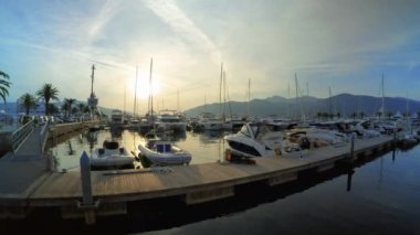 Boats at sunset in Porto Montenegro marina in Tivat - Editorial, 4K, Ultra Wide, Handheld