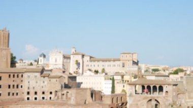 Pan from blurred ancient buildings in Rome to a seagull - 4K, Handheld