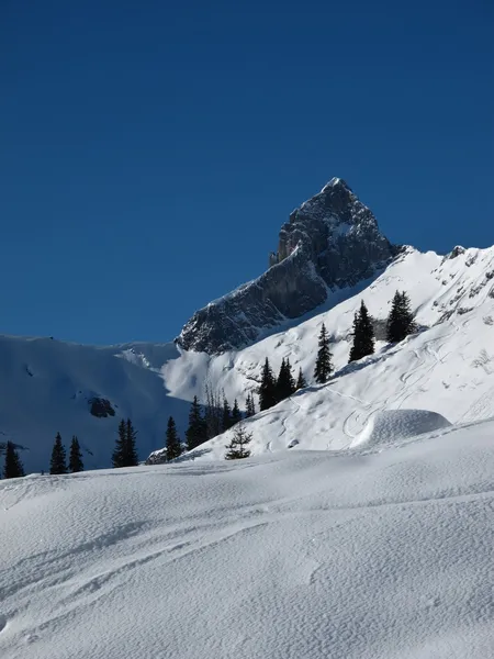 Snow landscape and mountain peak, Braunwald — Stock Photo, Image