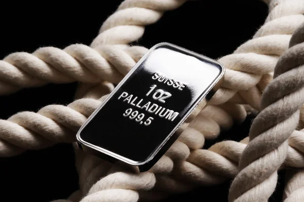 Palladium ingot on white rope — Stock Photo, Image