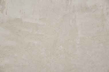 Eski beton duvar dokusu. İnşaat yüzeyi çiziyor. Soyut vintage taşları çatlatmış, kremsi doğal renk, grunge tavan arası, antika tasarım.