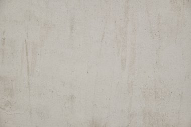 Eski beton duvar dokusu. İnşaat yüzeyi çiziyor. Soyut vintage taşları çatlatmış, kremsi doğal renk, grunge tavan arası, antika tasarım.