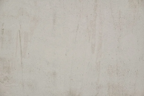 Eski beton duvar dokusu. İnşaat yüzeyi çiziyor. Soyut vintage taşları çatlatmış, kremsi doğal renk, grunge tavan arası, antika tasarım.