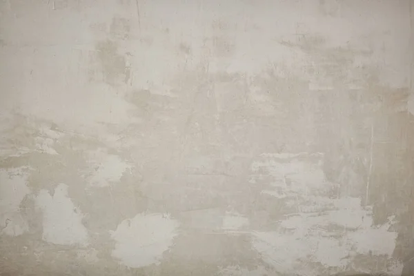Eski beton duvar dokusu. İnşaat yüzeyi çiziyor. Soyut vintage taşları çatlatmış, kremsi doğal renk, grunge tavan arası, antika tasarım.