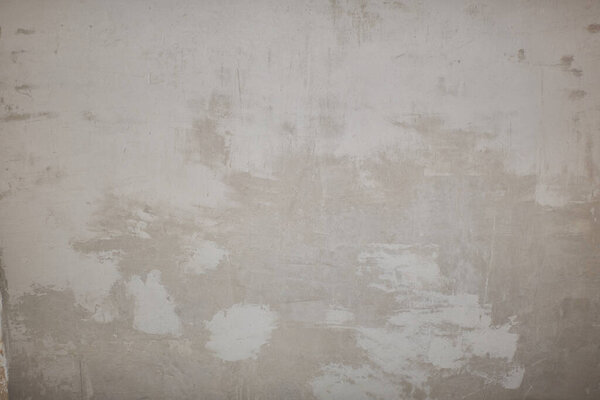 Старая бетонная текстура стены. Поверхность чертежа. Абстрактные винтажные трещины камней грубый, кремовый натуральный цвет, гранж чердак, антикварный дизайн.