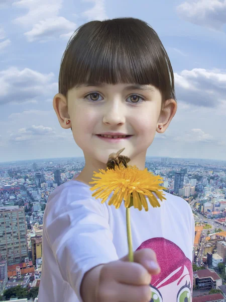 Girl hold yellow dandelion — Stock Photo, Image