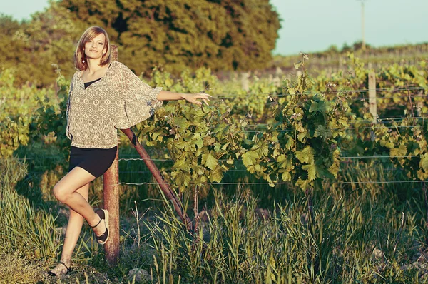 Beautiful woman in a vineyard — Stock Photo, Image