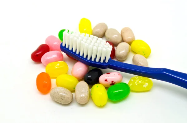 Toothbrush and candies — Stock Photo, Image