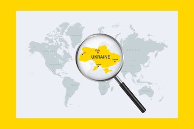 Map of Ukraine on political world map with magnifying glass