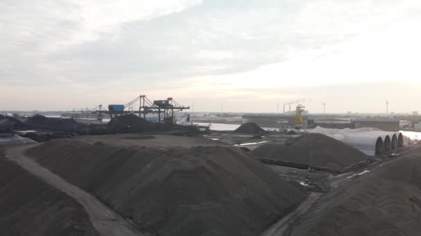 Aerial view of a coal storage facility loading dock in Amsterdam Westpoort, The Netherlands. Industrial harbour. — Stock Video