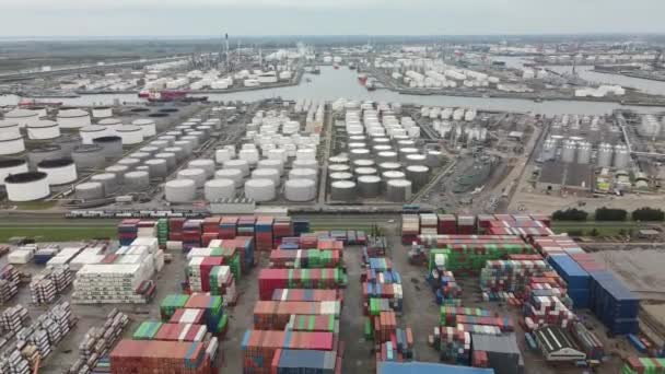 Container and silos in the Port of Rotterdam heavy industry and transportation along the Oude Maas Petroleum harbour aerial drone overview. — Stock Video