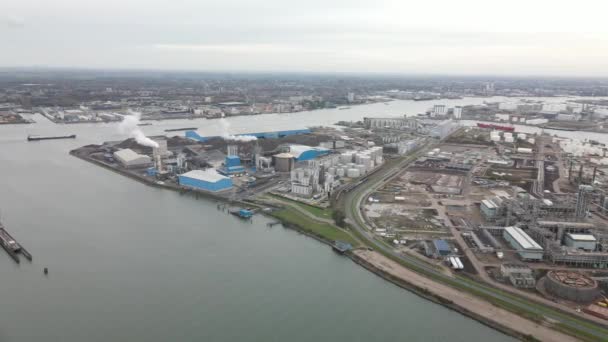 Container and silos in the Port of Rotterdam heavy industry and transportation along the Oude Maas Petroleum harbour aerial drone overview. — Stock Video