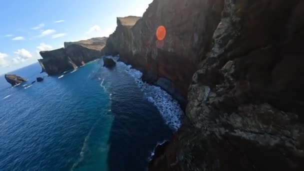 FPV racing drone Mountain surfing, and cliff diving along the rocks. Epic mountain landscape and ocean on Madeira island in Portugal. Beautifull nature. — Stock Video