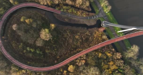 Aerial view of cycle and pedestrian bridge Nesciobrug in Amsterdam Oost near Ijburg and DIemen in The Netherlands, Holand, Europe. — Stock Video