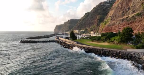 Coastline of Madeira Portugal beautifull sunny island the atlantic ocean aerial drone view. Aerial drone view. Calheta dramatic cliff and mountain landscape. — Stock Video