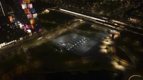 Aerial hyperlapse timelapse of Amsterdam Holendrecht station, public transport infrastructure in Amsterdam Zuid Oost aerial drone view. The Netherlands at night. — Stockvideo