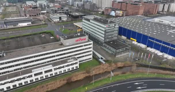 Amsterdam, 1st of January 2022, The Netherlands. Royal Ahrend. Ahrend Inspiration Centre Amsterdam furniture company building facade and logo. Aerial drone view — ストック動画