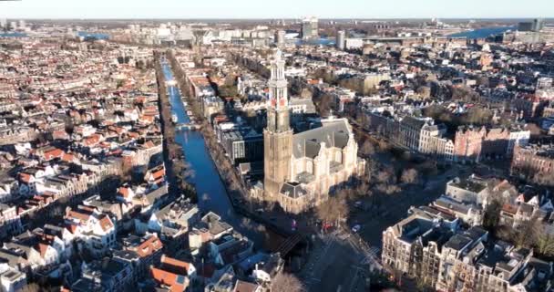 Amsterdam city center aerial drone view of the Westerkerk and the Jordaan urban area in the city center of Amsterdam. Along the canals. — Stockvideo