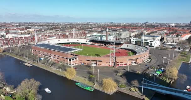 Olympic stadium Arena playground construction in Amsterdam city, The Netherlands. Old vintage stadium in Amsterdam Zuid. Aerial drone overview. — Stock Video
