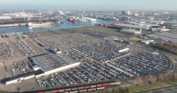 Amsterdam Westhaven, 2th of March 2022, The Netherlands. Aerial of a automotive car terminal parking lot storage loading area ready for distribution in the industrial harbour. — Stock Video